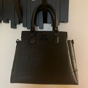 Black Steve Madden bag with strap